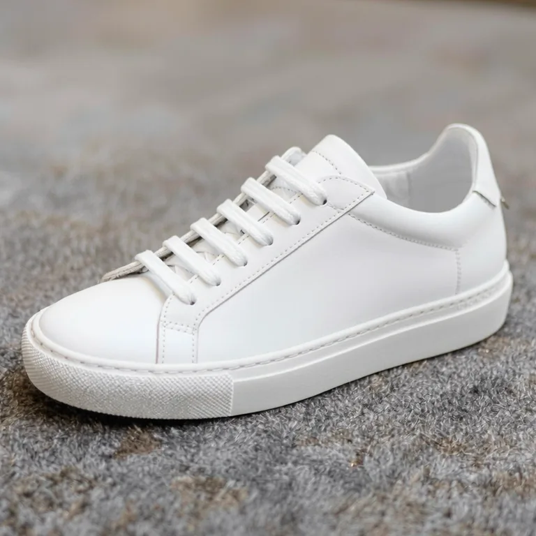 Last frame of the same product video ad after a slow push-in: the sneaker is closer, its shape and laces unchanged